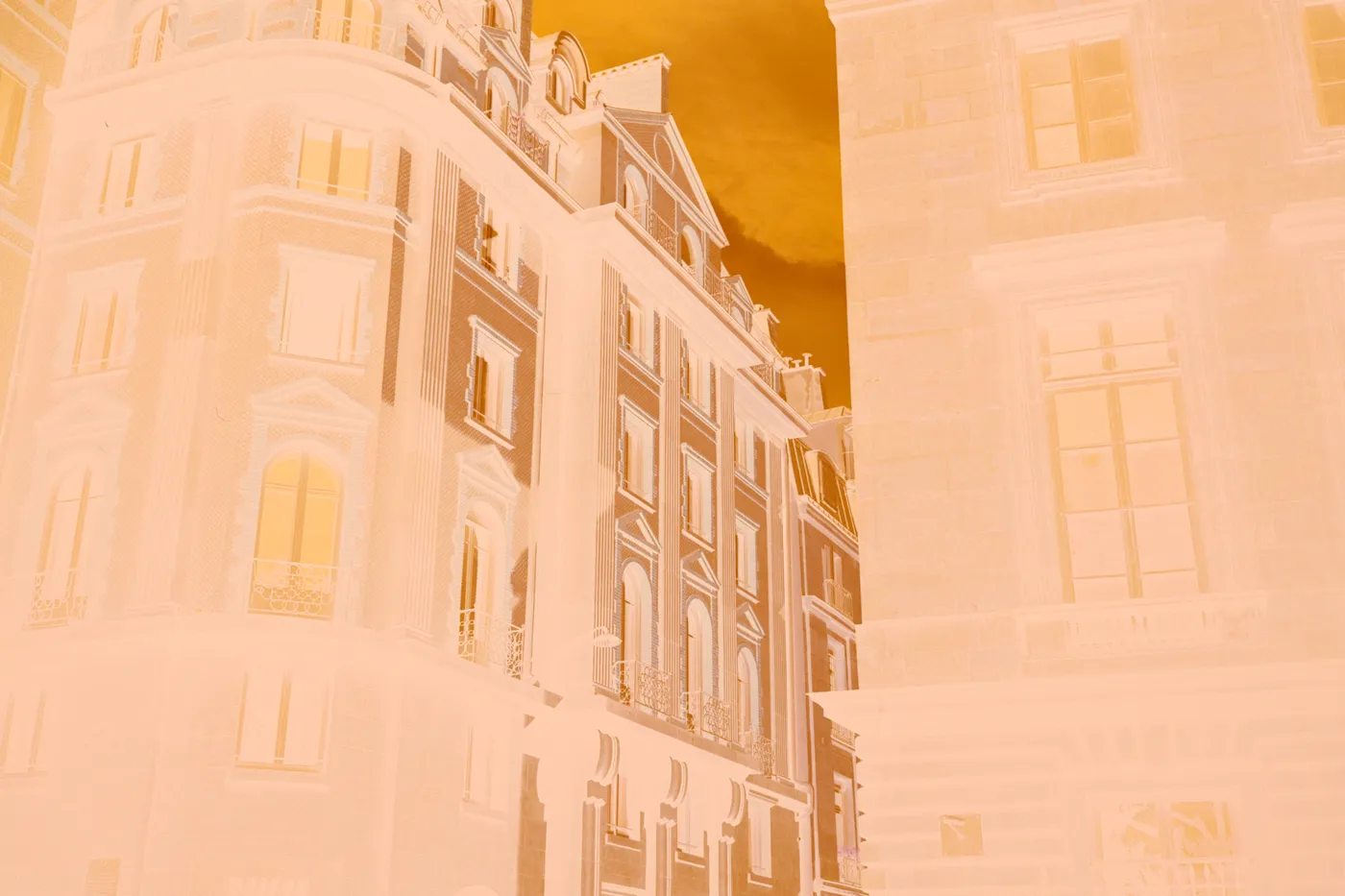 The raw scan of the facades: the sunlit stone turns dark blue, the shadow side pale, the sky a muddy yellow, under the orange base.