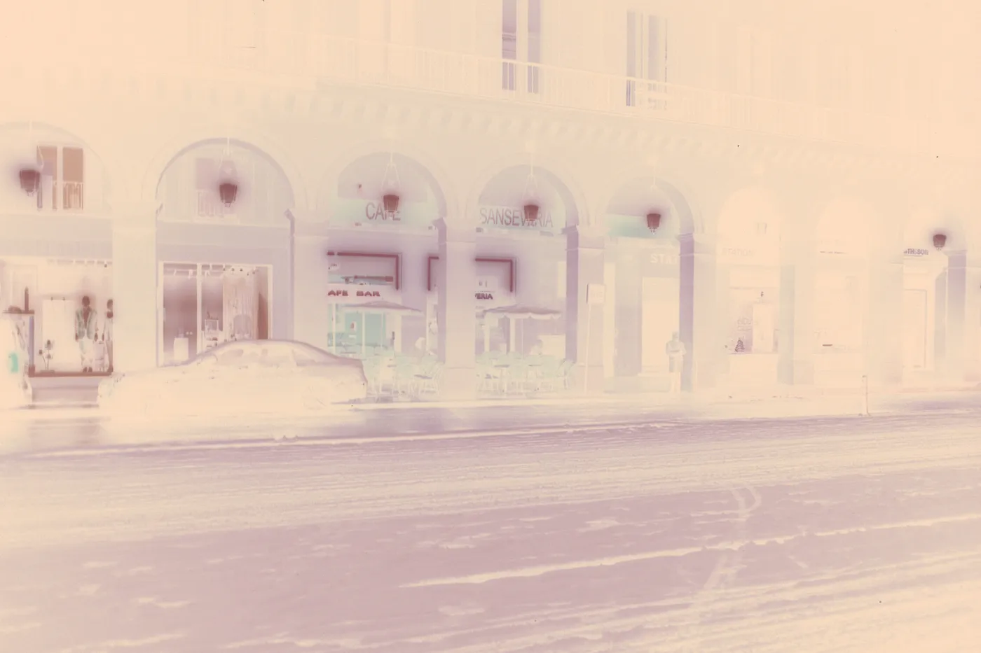 The raw scan of the snowy street: the snow reads dark, the lit cafe as a blue-black patch, under the orange base.